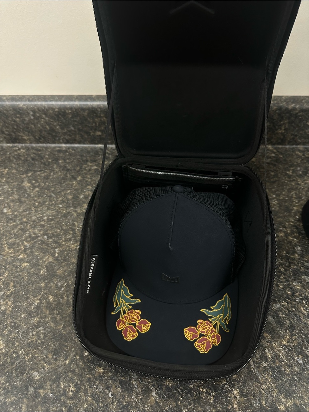 Melin Brand Black Trucker Hat with Yellow & Green Floral Embroidery